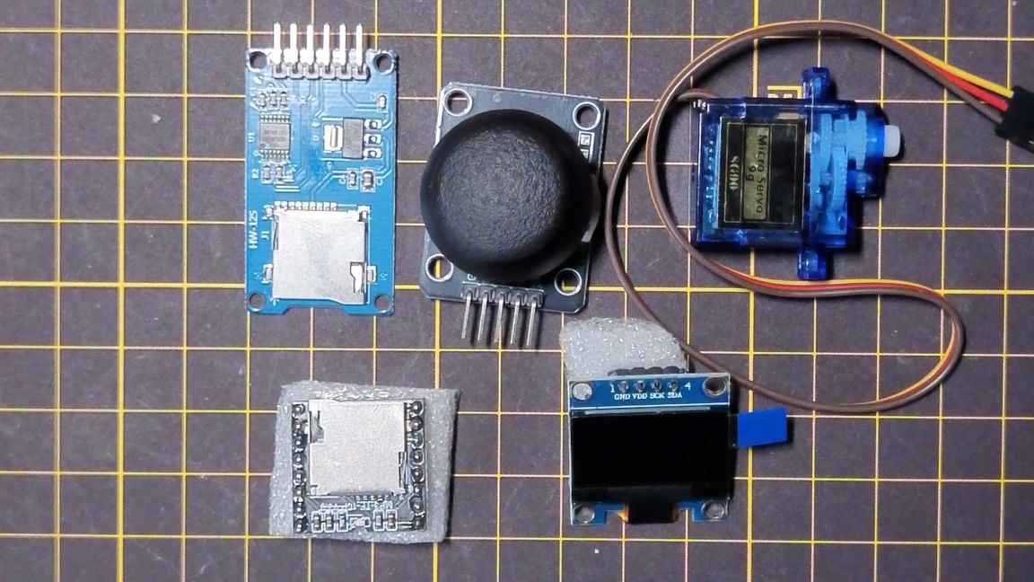 構想図：ジョイスティックで曲選択、サーボモーターがボリュームつまみに